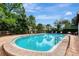 Inviting community pool with lounge chairs at 3124 Windrush Bourne # 10, Sarasota, FL 34235