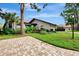 Condo exterior with landscaped yard at 3124 Windrush Bourne # 10, Sarasota, FL 34235