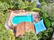 Community pool with a shaded seating area at 3124 Windrush Bourne # 10, Sarasota, FL 34235
