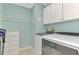 Convenient laundry room with a Whirlpool washer and dryer at 3124 Windrush Bourne # 10, Sarasota, FL 34235