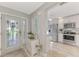 Entryway with view into kitchen and living areas at 3124 Windrush Bourne # 10, Sarasota, FL 34235