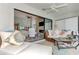 Spacious sunroom with comfortable seating and view of living area at 3124 Windrush Bourne # 10, Sarasota, FL 34235