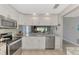 Modern kitchen with stainless steel appliances and granite countertops at 3124 Windrush Bourne # 10, Sarasota, FL 34235