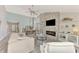 Living room with fireplace, high ceilings, and an open floor plan at 3124 Windrush Bourne # 10, Sarasota, FL 34235