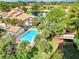 Community pool with lake access and walking bridge at 3124 Windrush Bourne # 10, Sarasota, FL 34235