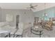 Bright and airy living room with access to the kitchen and outdoor area at 3124 Windrush Bourne # 10, Sarasota, FL 34235