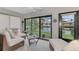 Relaxing sunroom overlooking a peaceful lake at 3124 Windrush Bourne # 10, Sarasota, FL 34235