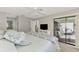 Bright bedroom with king bed and access to patio and bath at 3124 Windrush Bourne # 10, Sarasota, FL 34235