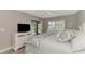 King-size bed, built-in TV, and access to a private patio at 3124 Windrush Bourne # 10, Sarasota, FL 34235