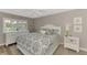 Spacious bedroom with king-size bed and ensuite bathroom at 3124 Windrush Bourne # 10, Sarasota, FL 34235