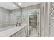 Bathroom with white cabinets and a large vanity at 3124 Windrush Bourne # 10, Sarasota, FL 34235