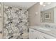 Clean bathroom with updated vanity and a floral shower curtain at 3124 Windrush Bourne # 10, Sarasota, FL 34235