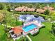 Community pool with surrounding patio and lounge chairs at 3124 Windrush Bourne # 10, Sarasota, FL 34235