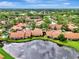 Aerial view of a community with lakefront villas at 3124 Windrush Bourne # 10, Sarasota, FL 34235