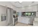 Updated kitchen with stainless steel appliances and granite countertops at 3124 Windrush Bourne # 10, Sarasota, FL 34235
