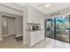 Bright kitchen with white cabinets, granite countertops, and stainless steel appliances at 3124 Windrush Bourne # 10, Sarasota, FL 34235
