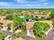 Aerial view of community pool and condos at 3124 Windrush Bourne # 10, Sarasota, FL 34235