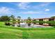Beautiful community with lakefront views and lush landscaping at 3124 Windrush Bourne # 10, Sarasota, FL 34235