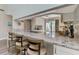 Granite countertop kitchen with breakfast bar and view to backyard at 3124 Windrush Bourne # 10, Sarasota, FL 34235