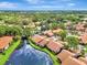 Aerial view of tranquil community nestled around a lake at 3124 Windrush Bourne # 10, Sarasota, FL 34235