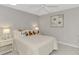 Cozy bedroom with plush bedding and charming artwork at 3124 Windrush Bourne # 10, Sarasota, FL 34235