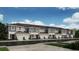 Row of modern townhouses with attached garages at 15056 Cuzcorro Ct, Nokomis, FL 34275