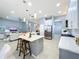 Modern kitchen with large island, stainless steel appliances, and white cabinets at 5170 Highbury Cir, Sarasota, FL 34238