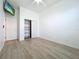 Simple bedroom with wood-look tile floors and closet at 5170 Highbury Cir, Sarasota, FL 34238