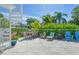 Relaxing patio with outdoor dining set and spiral staircase at 1655 Memory Ln, Sarasota, FL 34231