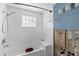 Bathroom featuring tub and shower adjacent to unfinished wall with exposed pipes at 105 2Nd Se Ave, Ruskin, FL 33570