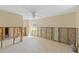 Bedroom undergoing renovations with tile flooring and a ceiling fan, offering a spacious layout at 105 2Nd Se Ave, Ruskin, FL 33570