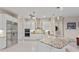 Well-lit kitchen featuring white cabinetry, stainless appliances, granite counters, and pendant lighting at 16211 Mulholland Rd, Parrish, FL 34219