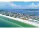 Beautiful aerial of a coastal community with beachfront condos, white sands, and turquoise ocean water at 1900 Gulf N Dr # 4, Bradenton Beach, FL 34217