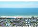 Condo complex near the beach, tennis courts, and a swimming pool, as seen from above at 1900 Gulf N Dr # 4, Bradenton Beach, FL 34217