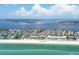 Stunning aerial view of the condo complex on Anna Maria Island directly on the beach near turquoise water and stunning homes at 1900 Gulf N Dr # 4, Bradenton Beach, FL 34217
