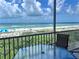 Relax on this balcony overlooking the beach with seating and a table for enjoying the ocean view at 1900 Gulf N Dr # 4, Bradenton Beach, FL 34217