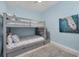 Cozy bedroom featuring a bunk bed, coastal-themed decor, and ample natural light at 1900 Gulf N Dr # 4, Bradenton Beach, FL 34217