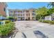 Beautiful multi-story building with balconies, covered parking, and brick paved driveway in a waterfront community at 1900 Gulf N Dr # 4, Bradenton Beach, FL 34217