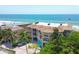 Beautiful multi-story beachfront property with lush landscaping, tiled roof, and ample parking at 1900 Gulf N Dr # 4, Bradenton Beach, FL 34217