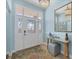 Welcoming foyer with decorative rug, stylish console table, and an attractive front door at 1900 Gulf N Dr # 4, Bradenton Beach, FL 34217