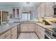 Well-equipped kitchen with stainless steel appliances, ample counter space, and light-colored cabinetry at 1900 Gulf N Dr # 4, Bradenton Beach, FL 34217