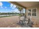 Enjoy sunsets from this covered patio overlooking the lake at 4618 Arbor Gate Dr, Bradenton, FL 34203