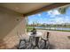 Covered patio with seating area overlooking water at 4618 Arbor Gate Dr, Bradenton, FL 34203