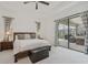 Main bedroom with king size bed and sliding door to patio at 5713 Cheech Gln, Lakewood Ranch, FL 34211
