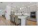 Modern kitchen with gray cabinets, quartz countertops, and stainless steel appliances at 5713 Cheech Gln, Lakewood Ranch, FL 34211