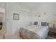 Bright bedroom with a queen bed, nightstands, and ample closet space at 5713 Cheech Gln, Lakewood Ranch, FL 34211