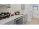 Modern wet bar with quartz countertop, wine rack, and beverage cooler at 5713 Cheech Gln, Lakewood Ranch, FL 34211