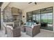 Outdoor kitchen with grill, pizza oven, and seating area at 5713 Cheech Gln, Lakewood Ranch, FL 34211