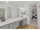 Bathroom with double vanity and view into bedroom at 5713 Cheech Gln, Lakewood Ranch, FL 34211