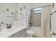 Clean bathroom with a bathtub, shower, and updated vanity at 5713 Cheech Gln, Lakewood Ranch, FL 34211
